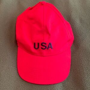 NWOT red USA baseball hat. USA is blue embroidery. One size